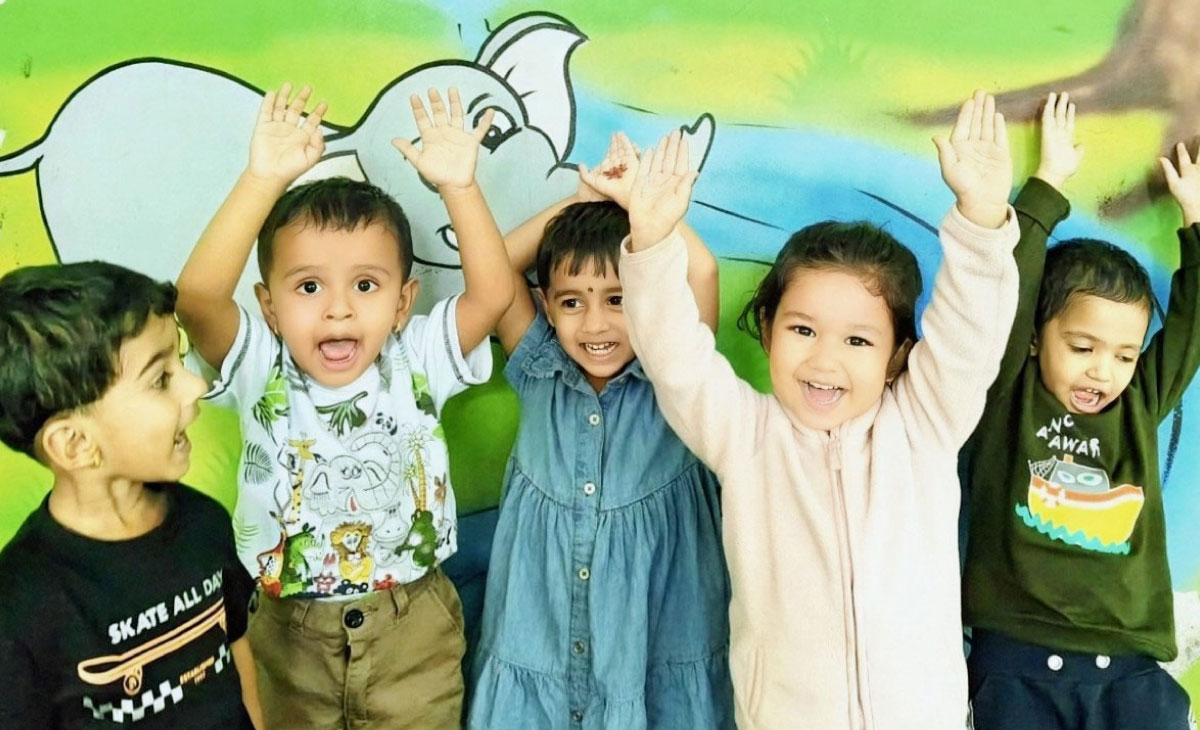 Children laughing and having fun during outdoor playtime at Utkarsha School