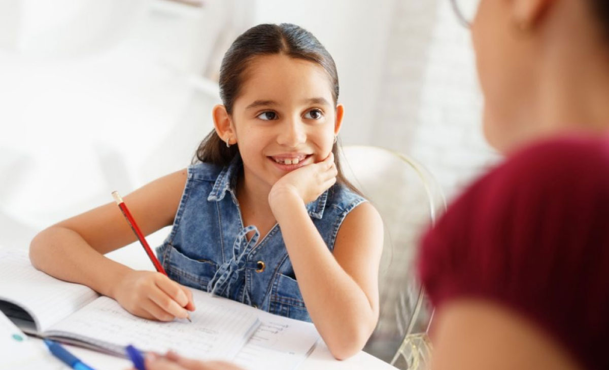 Child practicing handwriting skills at Utkarsha Play School, Sangvi Pune