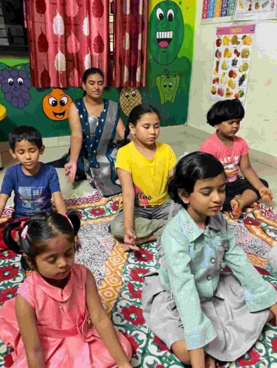 Children sitting quietly in meditation during class at Utkarsha Day Care, Sangvi Pune