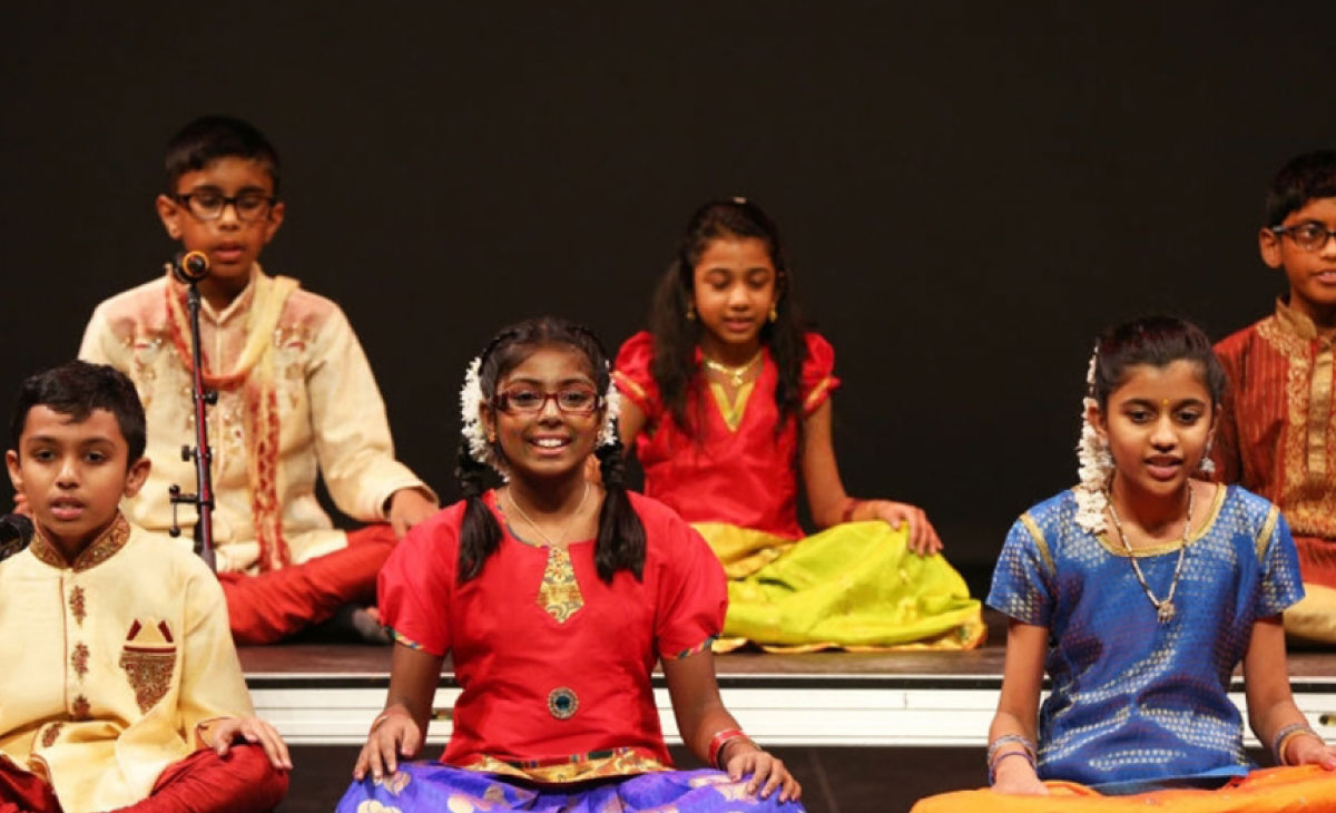 Teacher leading a group singing session at Utkarsha Day Care