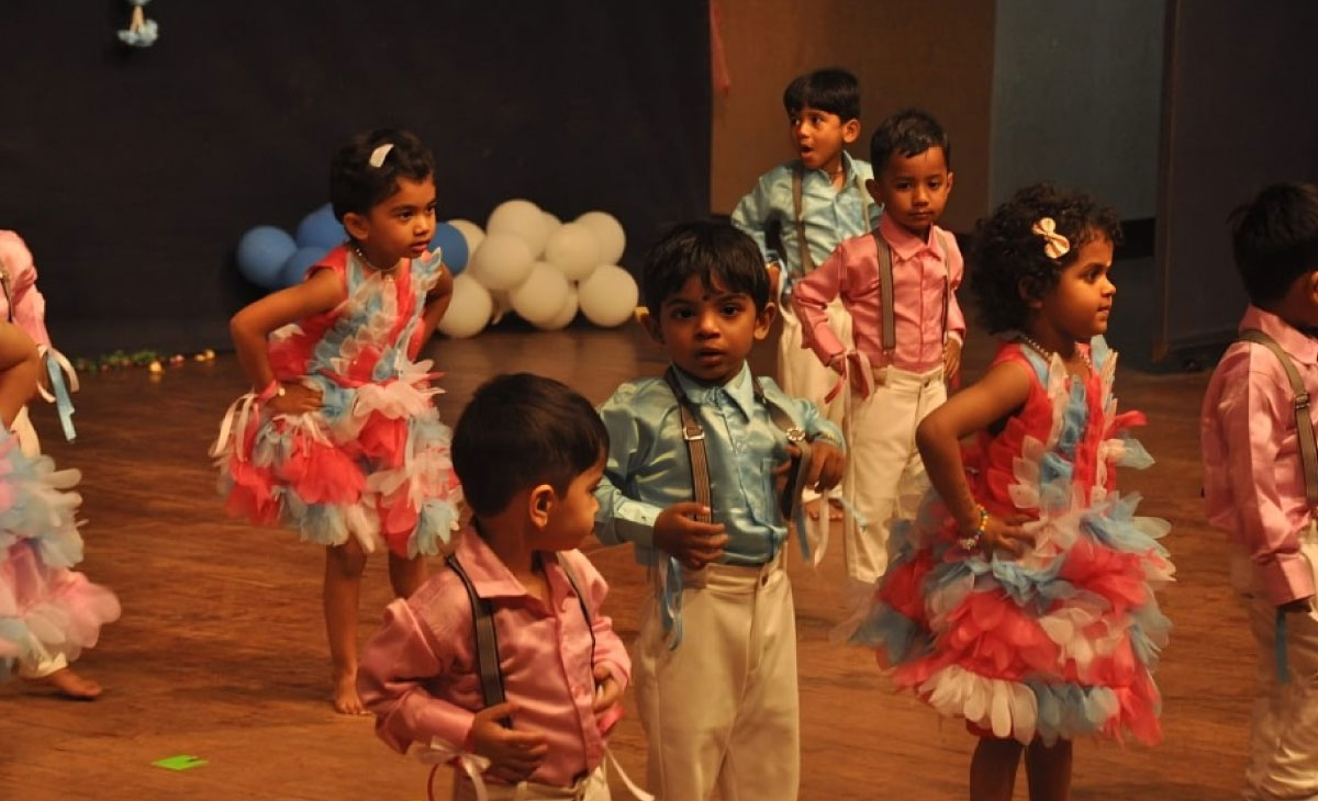 Teachers addressing students in school gathering at Utkarsha Play School, Pune