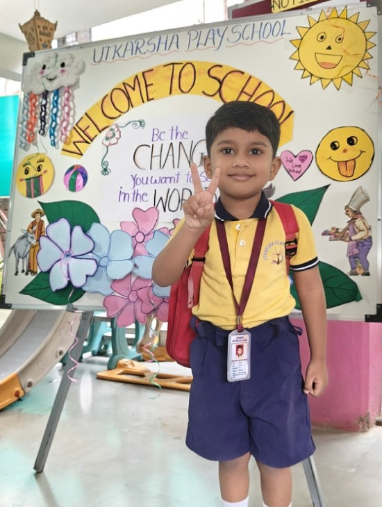 Toddler in Utkarsha Play School uniform ready for the day